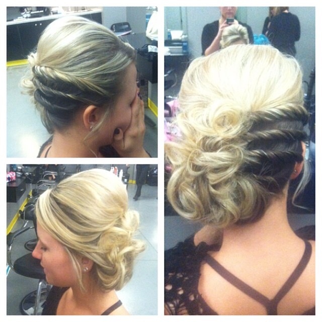 Curled and twisted updo by Amber's Beauty School students